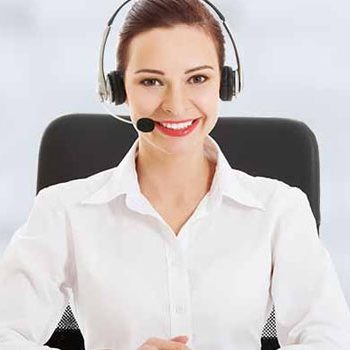 A friendly operator wearing a headset and microphone.