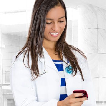 A doctor checking her pager.